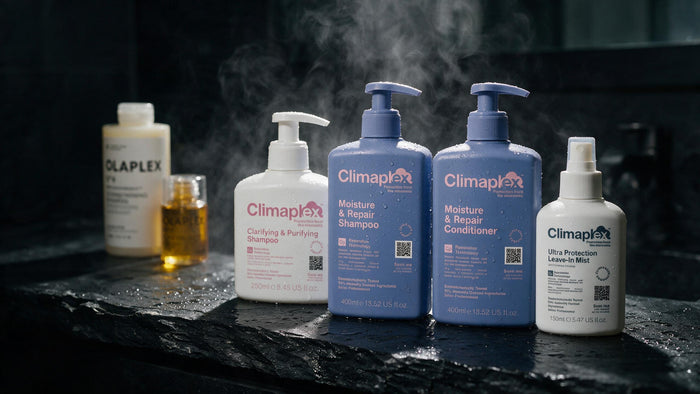 Gama Climaplex en primer plano sobre piedra oscura, con Olaplex Nº4 y Nº7 desenfocados al fondo: el cambio de rutina
